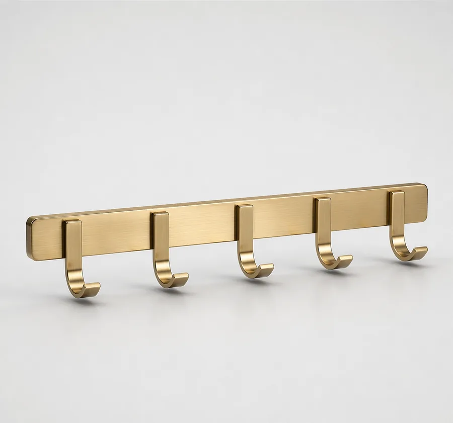 Linea brushed gold five-hook wall rail, studio product photo